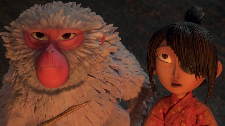 Sariatu and Kubo look up at Kubo and the two Strings