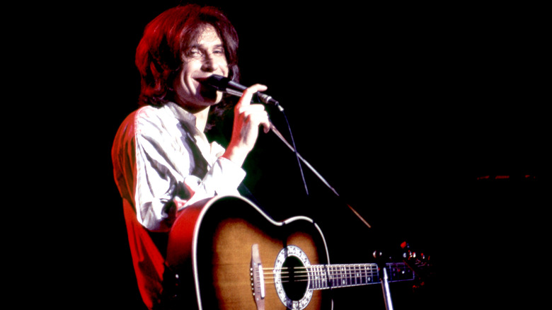 Ray Davies sings into the microphone