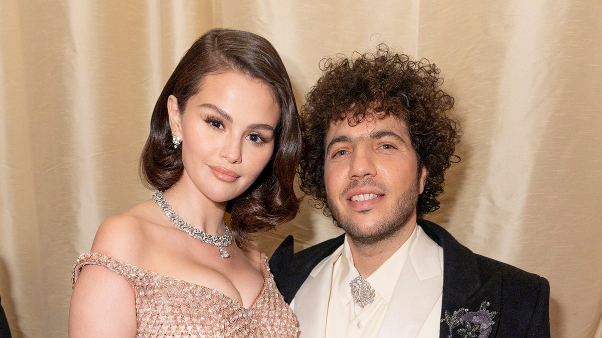 Selena Gomez wears a glittery strapless dress with her boyfriend benny blanco in a white suit