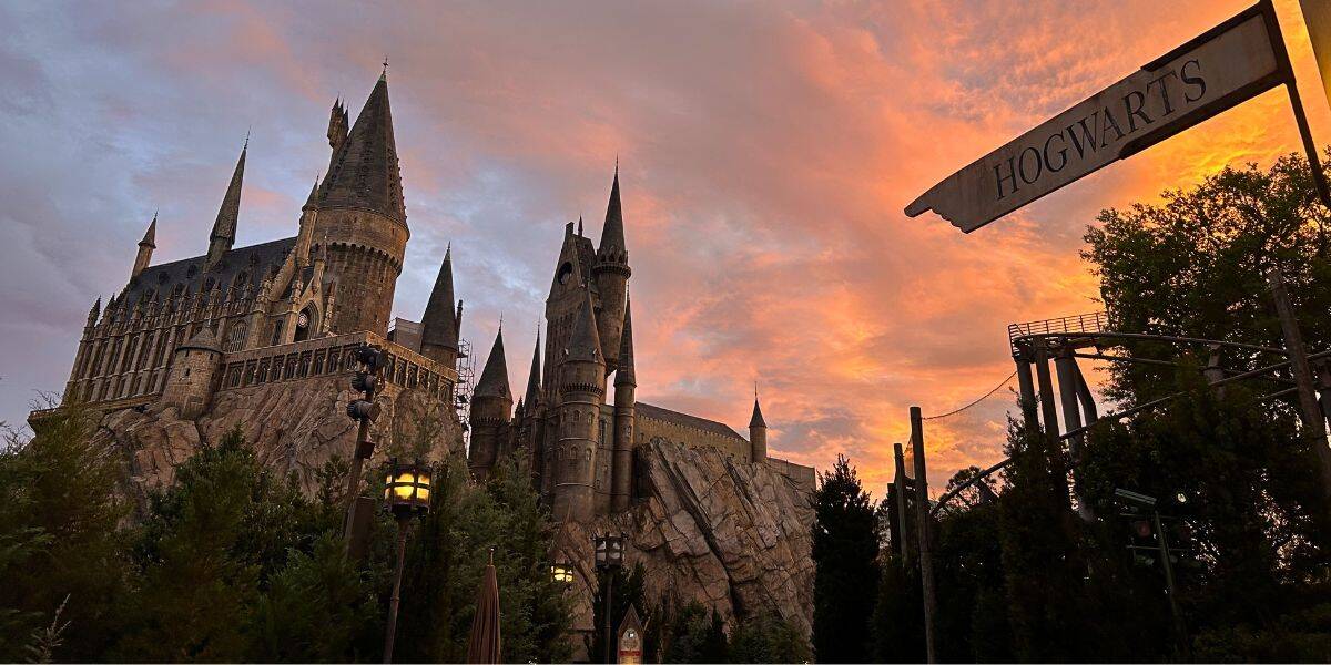 Hogwarts Castle in Universal's Islands of Adventure in the Wizarding World of Harry Potter at Universal Orlando Resort at sunset.