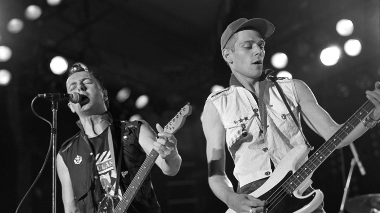 The Clash play guitars and sing