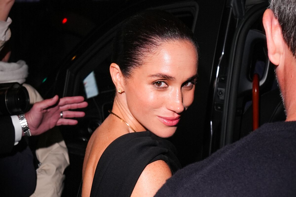 Meghan Markle is looking over her shoulder