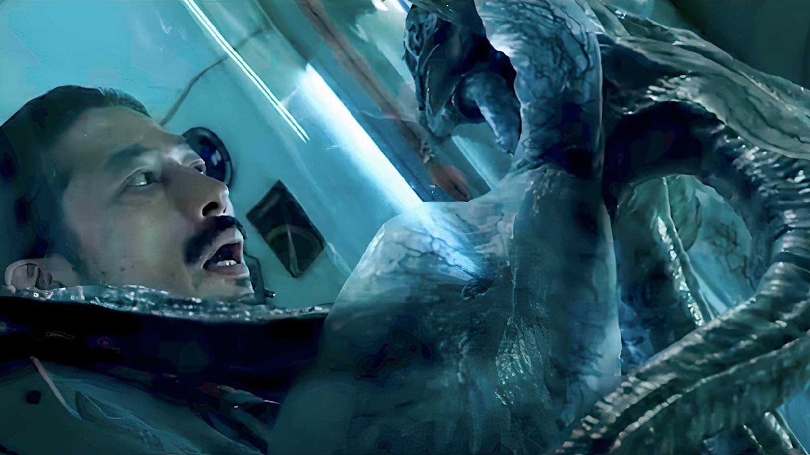 Sho (Hiroyuki Sanada) looks at Calvin through the glass of Life