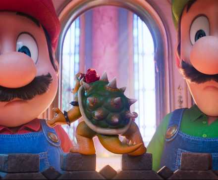 Mario and Luigi stare down little Bowser in a scene from The Super Mario Galaxy Movie