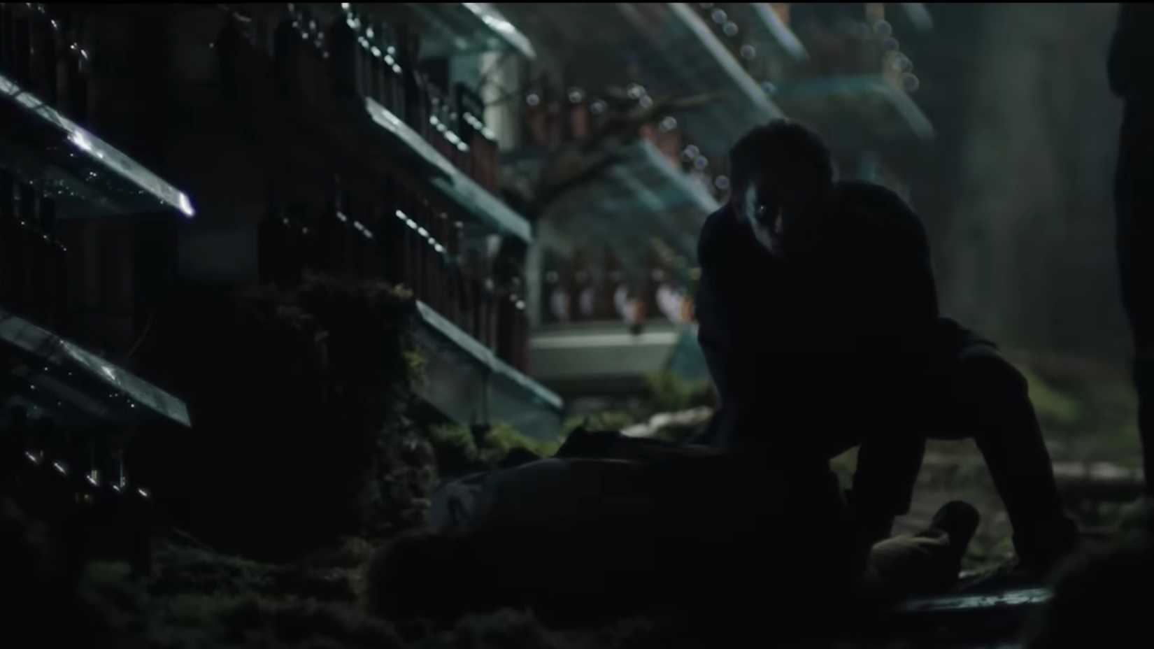 A shadowy man standing over a corpse in a dream sequence in The Ritual