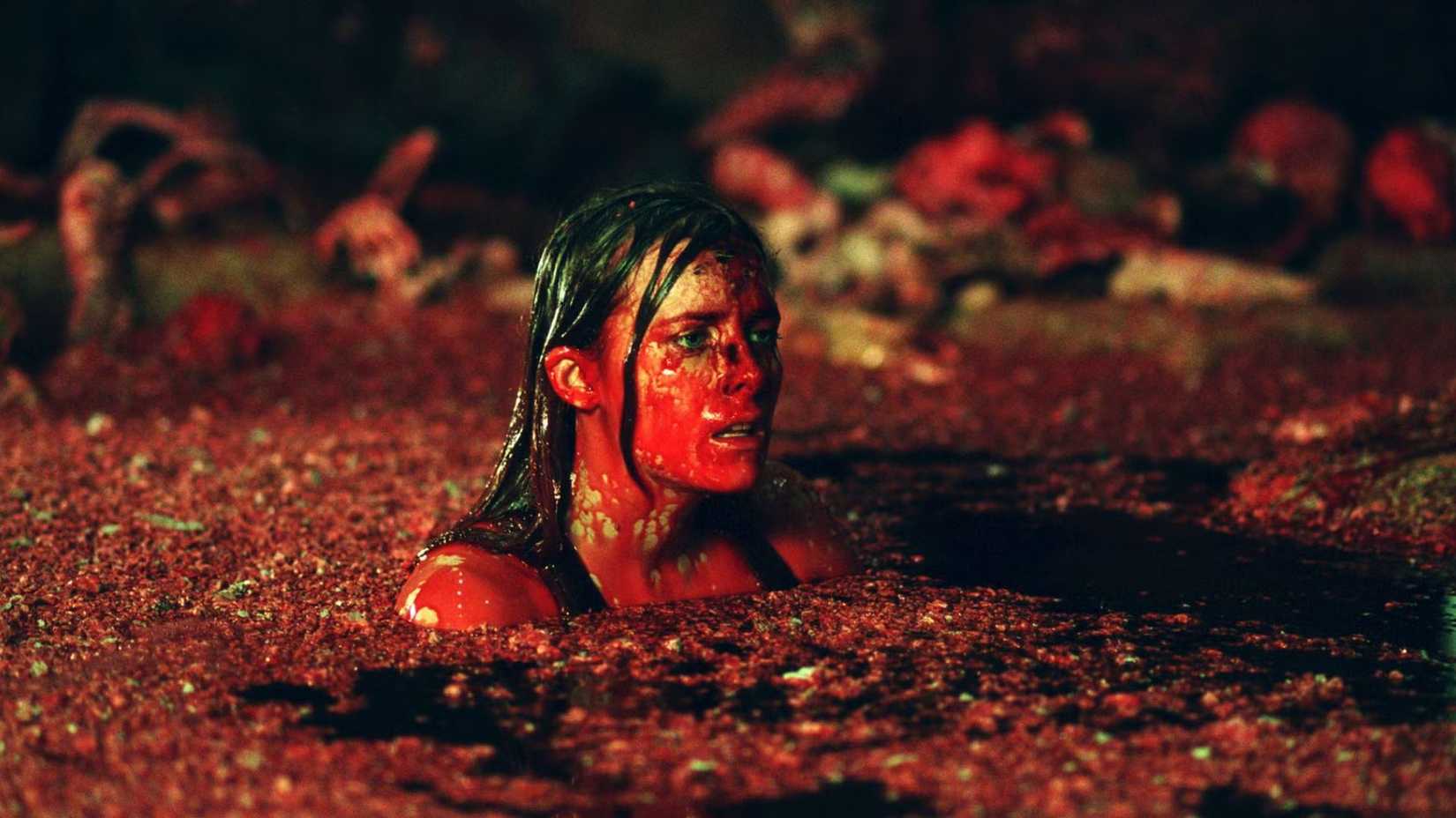 Shauna MacDonald as Sarah in the bloody water in The Descent