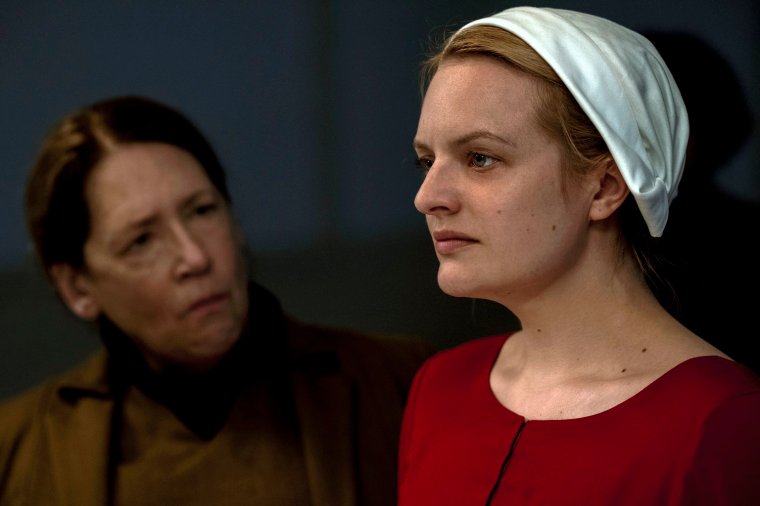 This photo released by Hulu shows Ann Dowd, left, and Elisabeth Moss in an episode of the series, "The Handmaid's Tale," returning for a second season on April 25. (George Kraychyk/Hulu via AP)