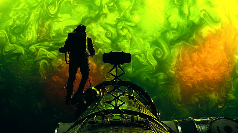 Ryan Gosling as Ryland Grace piloting his spaceship above a green planet in Project Hail Mary.