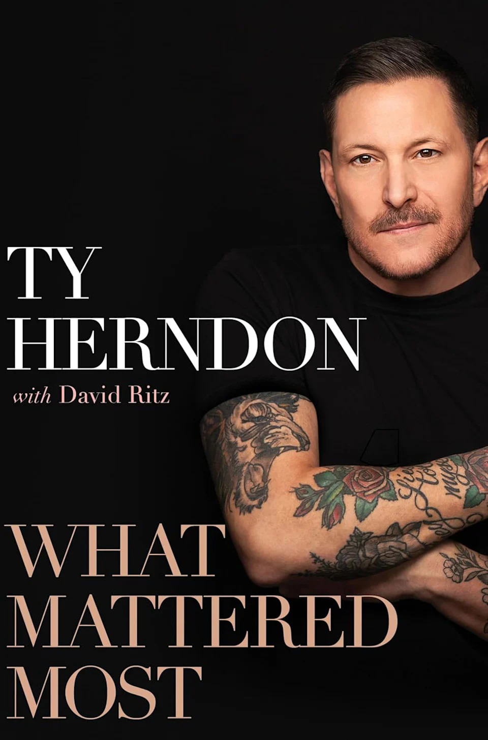 Book cover of What Matters Most. Herndon, wearing a black T-shirt that shows off his tattoos, looks into the camera.